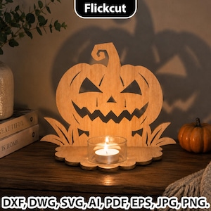 May include: A light brown wooden cutout of a jack-o'-lantern with a jagged mouth and triangular eyes, featuring a small circular base with a clear glass tea light holder containing a lit white candle, with the text Flickcut at the top.