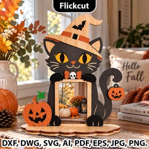 May include: A wooden Halloween-themed photo frame featuring a black cat wearing an orange witch hat with a bat silhouette, a small skull bowtie, and a jack-o'-lantern pumpkin on each side. The frame is set on a scalloped base.