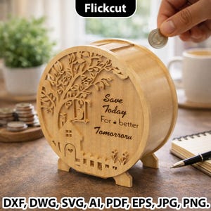 May include: A wooden piggy bank with a tree and house design cut out on the front. The text "Save Today For a better Tomorrow" is engraved on the front. A hand is dropping a coin into the slot. The bank is on a wooden surface.