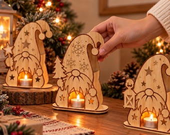 May include: Three light-colored wooden gnome-shaped candle holders with cut-out designs including stars, snowflakes, and trees. Each gnome features a central opening holding a small lit tea light candle. The text Flickcut is at the top.