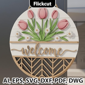 Op de afbeelding: Een ronde houten welkomstbord met roze tulpen, witte madeliefjes en groene bladeren. Het woord "welcome" staat in cursief schrift. Het onderste gedeelte heeft een geometrisch ontwerp. Geschikt voor een voordeur.