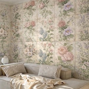 May include: A beige sectional sofa with two striped pillows and a cream-colored throw blanket. The wall behind the sofa is covered in floral wallpaper featuring roses and other flowers in soft pastel colors.