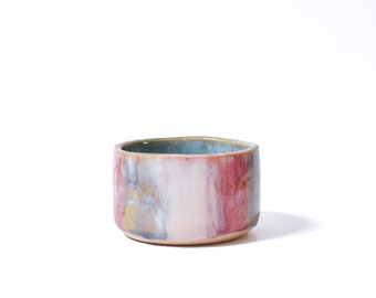 Kyen, lovely striped an colored little bowl. Made from speckled clay, suits any place