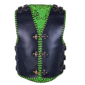 May include: A black leather vest featuring a vibrant neon green paisley patterned lining. The vest includes three front metal hook closures, adjustable side straps with buckles, and shoulder straps with buckles, all accented with dark stitching.