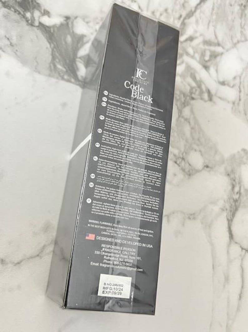 May include: A black rectangular box with the text "IC Code Black" in white. The box has a list of ingredients and other information printed on it. The box is designed and developed in the USA.