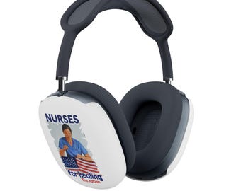 May include: Over-ear headphones with a white ear cup featuring a graphic of a nurse, the American flag, and the words "NURSES" and "for healing the nation." The headphones have a dark gray headband and ear cushions.