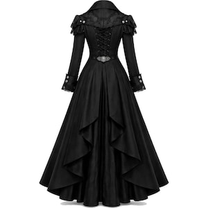May include: A long black coat with a Victorian-era design. The coat features a high collar, lace detailing, and a corset-style back. The sleeves have buttoned cuffs with lace trim, and the skirt flares out. A decorative belt cinches the waist.