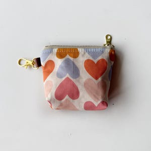 Itty bitty pouch with keychain in big bold hearts