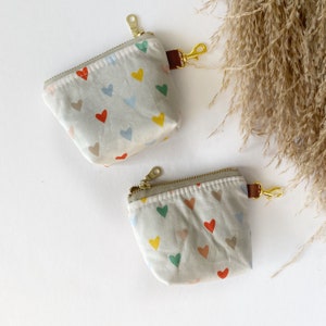 Itty bitty pouch with keychain in rainbow hearts
