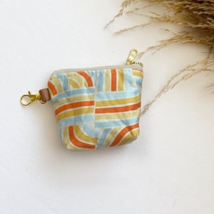Itty bitty pouch with keychain in blue rainbow slide