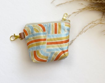 Itty bitty pouch with keychain in blue rainbow slide