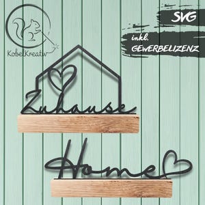 Könnte beinhalten: Zwei dekorative Holzregale mit schwarzen Metallaussparungen. Das obere Regal zeigt eine Hausform mit einem Herzen und dem deutschen Wort "Zuhause". Das untere Regal hat das Wort "Home" mit einem Herzen. Der Hintergrund ist helltürkis.