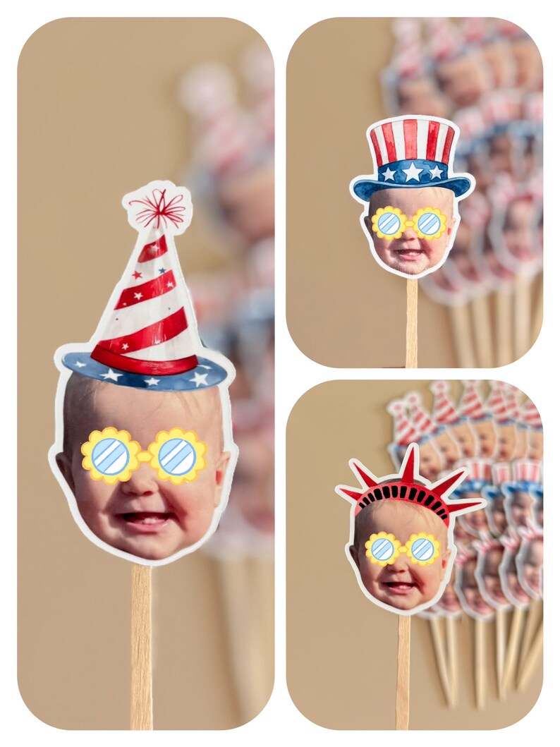 May include: A collection of custom cupcake toppers featuring a baby's face wearing yellow-rimmed glasses. The toppers include illustrations of a red and white striped party hat, a patriotic top hat, and a red Statue of Liberty crown on wooden sticks.