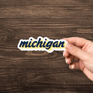 University of Michigan script decal Sticker | navy and maize layered text