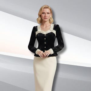 May include: A black velvet top with long sleeves and a square neckline, trimmed with cream lace. The top has small, round gold buttons and is worn with a cream pencil skirt. The outfit is a classic, elegant style, suitable for formal occasions.