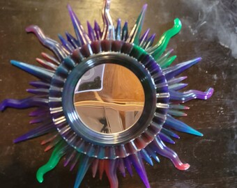 Resin sun with glassless/acrylic mirror.  Very colorful decoration for anywhere you choose!