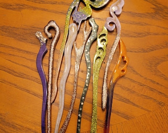 Resin hair pins variety of styles and colors.