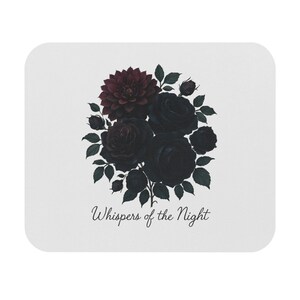May include: White mousepad featuring a floral design. The design includes a dark red dahlia and black roses with green leaves. The text "Whispers of the Night" is written in a cursive font at the bottom of the mousepad.