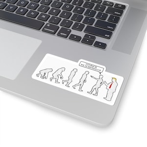 May include: A white sticker with a cartoon depicting human evolution, ending with a politician. The sticker has the text "GO BACK WE SCREWED UP" in a speech bubble. The sticker is on a laptop.