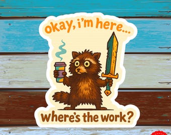 May include: A sticker featuring a cartoon raccoon holding a coffee cup and a sword. The raccoon has a disgruntled expression. Text on the sticker reads "okay, I'm here... where's the work?" The sticker has a distressed wood background.