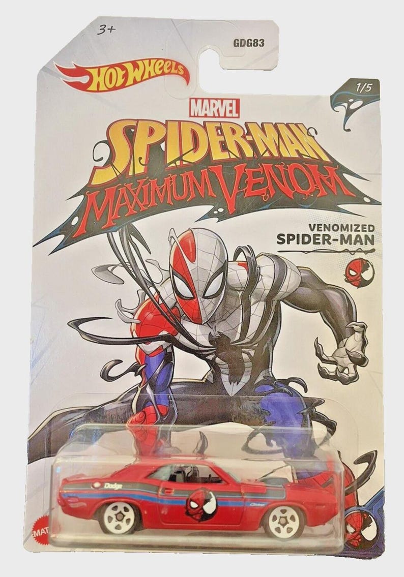 May include: Hot Wheels die-cast car featuring a red Dodge with Spider-Man graphics, part of the Marvel Maximum Venom series. The packaging includes the Hot Wheels and Marvel logos, along with the text "Venomized Spider-Man".
