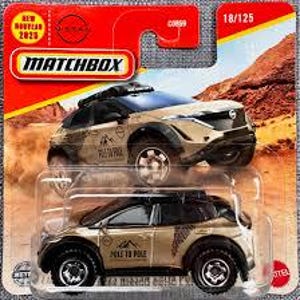 May include: Matchbox die-cast model of a Nissan Ariya SUV in a desert-themed package. The vehicle is tan with black accents and features the text "POLE TO POLE". The packaging includes the Matchbox logo, "NEW MODEL 2023", and the number 18/125.