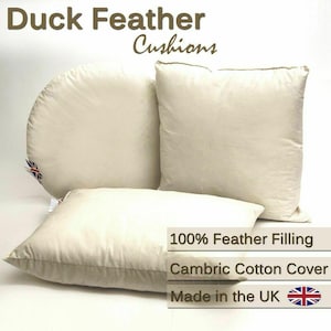 May include: Off-white duck feather cushions in various shapes. The image shows a square, a rectangular, and a half-circle cushion. Text on the image reads "Duck Feather Cushions", "100% Feather Filling", "Cambric Cotton Cover", and "Made in the UK".