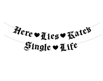 May include: Black and white banner with the text "Here Lies Single Life" and "Kates" with hearts between the words.