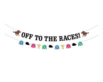 May include: A decorative banner with the phrase "OFF TO THE RACES!" and illustrations of horses, riders, jockey silks, and hats. The banner is suspended on a curved line against a white backdrop, suitable for a racing event.
