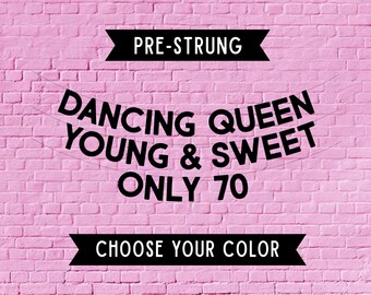 May include: A pre-strung banner featuring black text on a pink brick background. The text reads PRE-STRUNG at the top, DANCING QUEEN YOUNG & SWEET ONLY 70 in the center, and CHOOSE YOUR COLOR at the bottom, displayed on two black banners.