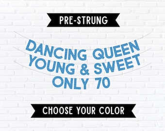 May include: A blue glitter banner featuring the text DANCING QUEEN YOUNG & SWEET ONLY 70 arranged on three lines. The banner includes black banners at the top and bottom with the white text PRE-STRUNG and CHOOSE YOUR COLOR respectively.