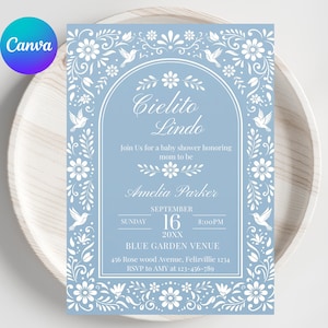 May include: A baby shower invitation with a light blue background and white floral and bird designs. The text reads "Cielito Lindo" and invites guests to celebrate Amelia Parker. Details include the date, time, and venue.