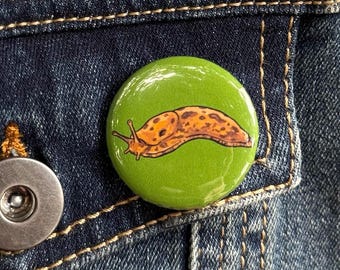 Banana Slug Button - 1.25" Badge - PNW Icon Pin - Seattle Souvenir - Gorpcore Accessory - Cute Bug Pin - Hiking Backpack Flare