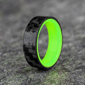 Horizontal Carbon Fiber Ring with a Green Glow Core