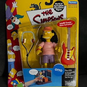 May include: A Playmates "World of Springfield" interactive figure of Otto from The Simpsons. The figure is in a clear plastic package with a yellow and red backing. Otto is wearing a pink shirt, purple shorts, and a red hat. Includes a red guitar and headphones.