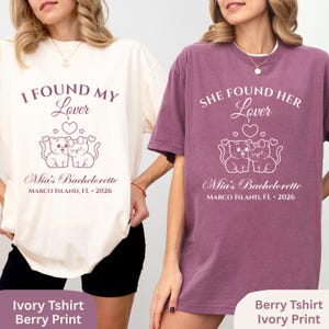 May include: Two t-shirts, one ivory and one berry, with matching designs. Each shirt features the text "I FOUND MY Lover" or "SHE FOUND HER Lover", with a cat graphic and "Mia's Bachelorette, MARCO ISLAND, FL &bull; 2026".