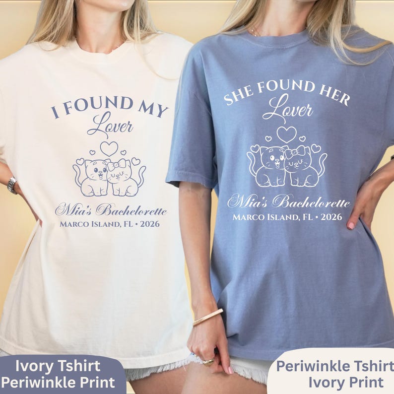 May include: Two t-shirts, one ivory and one periwinkle, with matching designs. Each shirt features the text "I FOUND MY Lover" or "SHE FOUND HER Lover", with a graphic of two cats and the text "Mia's Bachelorette, Marco Island, FL 2026."