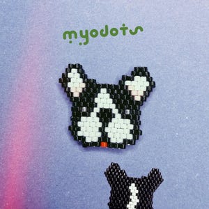 May include: Two beaded French bulldog designs in black, white, and red. The larger design is a full head, and the smaller one is a simplified version. The background is a gradient of purple and blue with the text "myodots" in green.