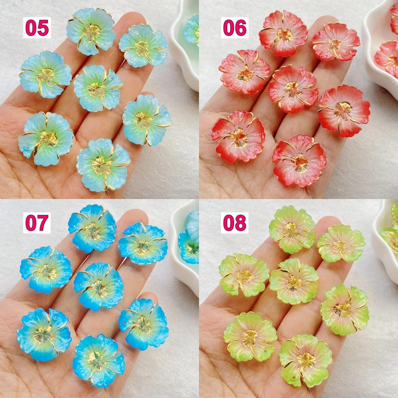 May include: A collection of flower-shaped beads in various colors, including light blue, red, blue, and green. Each bead has a gold-colored center. The image is divided into four sections, each showcasing a different color variation of the floral beads.