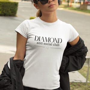 May include: A set of three ceramic mugs with a speckled, matte finish. The mugs are in shades of cream, light gray, and dark gray. Each mug has a simple, minimalist design, perfect for coffee or tea.