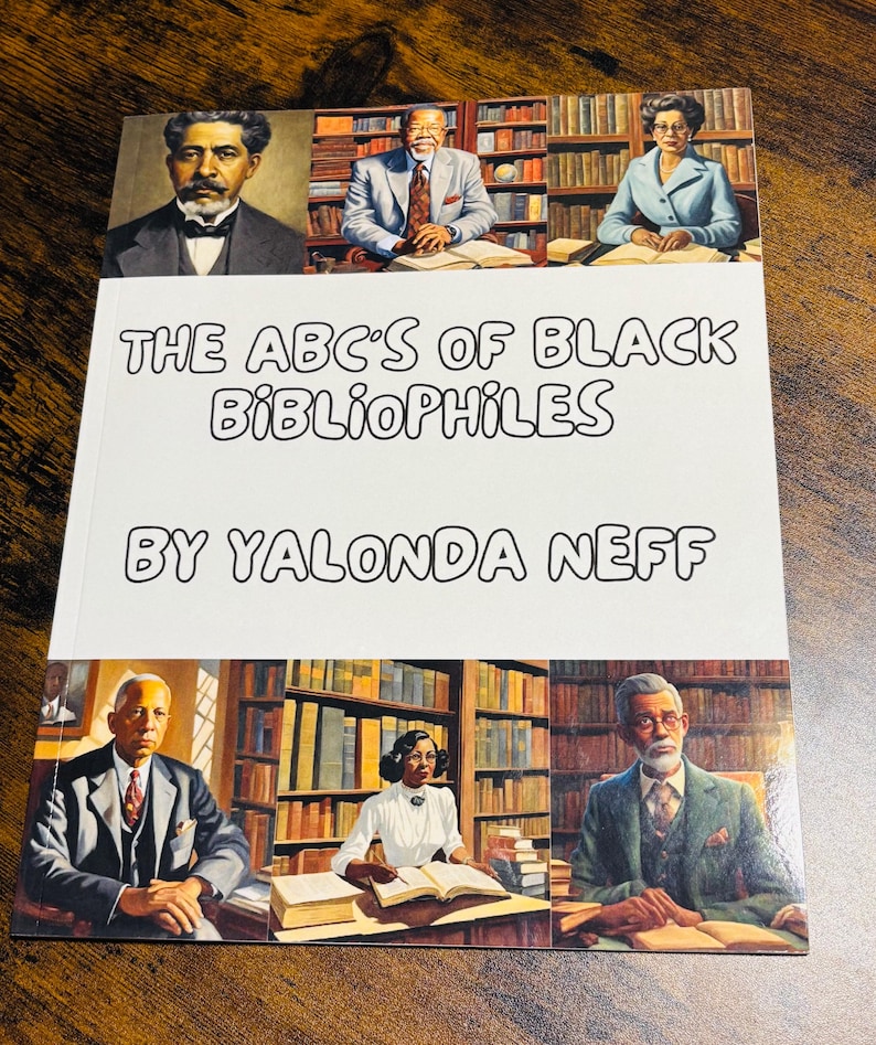 May include: A book titled "THE ABC'S OF BLACK BIBLIOPHILES" by Yalonda Neff. The cover features portraits of people and bookshelves. The book is on a dark wooden surface.