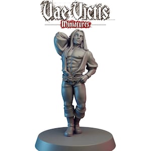 May include: A miniature figurine of a male figure with long hair, wearing a partially unbuttoned shirt, pants, and boots. The figure is standing on a circular base. The text "Vae Victis Miniatures" is above the figure.