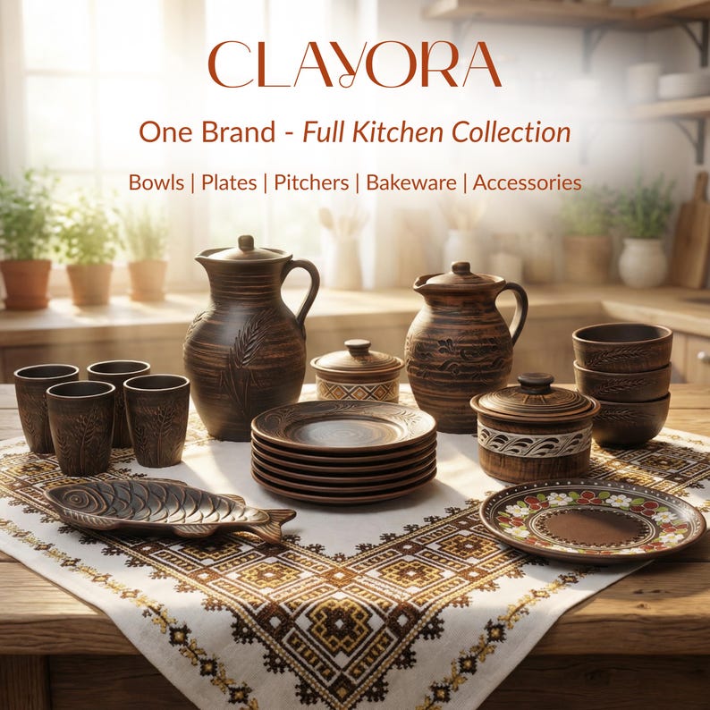 May include: A collection of rustic brown ceramic kitchenware, including pitchers, plates, bowls, and serving dishes. The items are arranged on a patterned tablecloth. The image includes the text "CLAYORA" and "One Brand - Full Kitchen Collection".