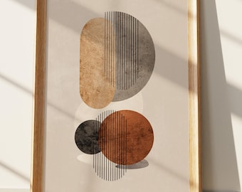 May include: A framed wall art print featuring an abstract composition of geometric shapes. The design includes a textured tan oval, a gray semicircle, a dark charcoal circle, and a rust-colored circle, all overlaid with thin vertical black lines.