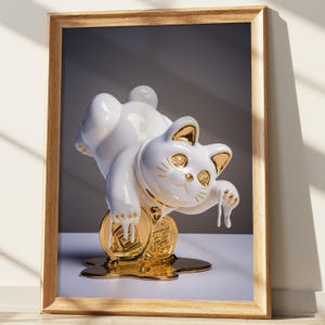 May include: A white ceramic Maneki-neko cat figurine with gold accents, posed on a gold coin. The cat is in a playful position, with one paw raised. The figurine is displayed in a wooden frame.