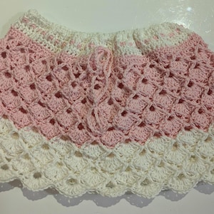 Size 2 Girls Pink & white Crochet skirt with thin elastic waistband. Get 15percent off during March only use code 15OFFMARCHONLY at checkout