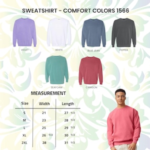 Pu&ograve; includere: Felpe Comfort Colors 1566 nei colori viola, bianco, blu jeans, pepe, verde acqua e cremisi. L'immagine include una tabella delle taglie con misure in pollici, la larghezza varia da 53,3 cm a 71,1 cm e la lunghezza da 69,9 cm a 80 cm.