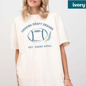 vintage sports tee distressed football design