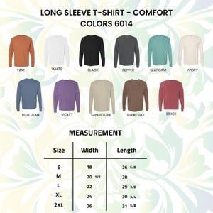 Pu&ograve; includere: Esposizione di magliette a maniche lunghe in vari colori, tra cui bianco, nero e blu. L'immagine include una tabella delle taglie con misure in centimetri. Il testo in alto recita "LONG SLEEVE T-SHIRT - COMFORT COLORS 6014."