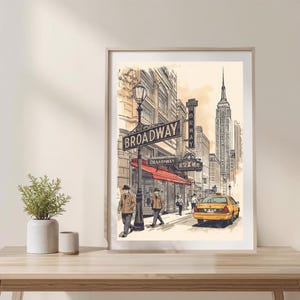 May include: An artistic print of a New York City street scene featuring a Broadway sign, a yellow taxi, and the Empire State Building. The artwork is in a vintage style with a sepia tone.